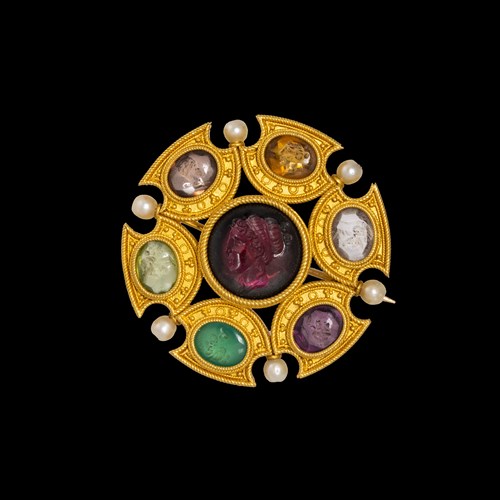 Attributed to Robert Phillips. An Etruscan Revival gold brooch with intaglios and pearls.
